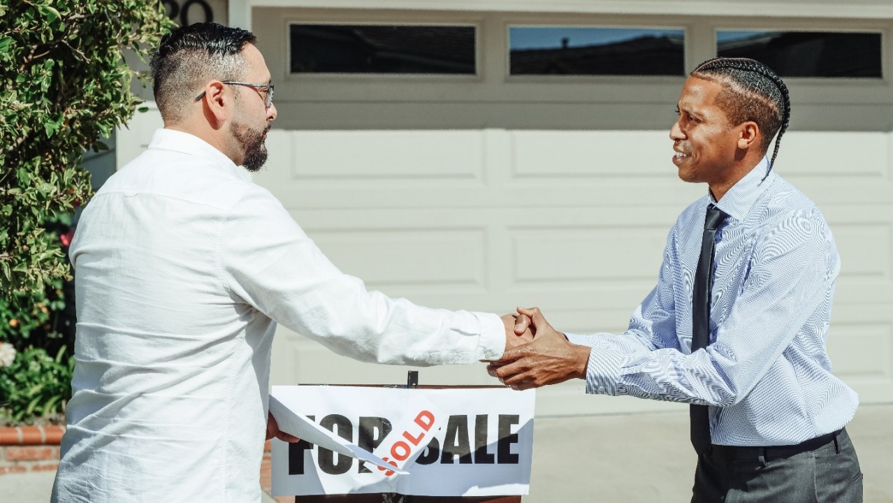 Realtor Shaking a Client’s Hand